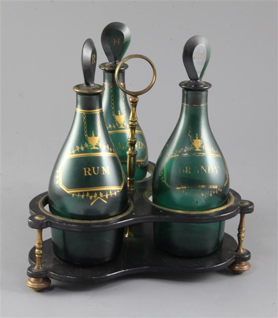 A Regency gilt decorated green glass three bottle decanter stand, total height 26cm